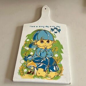 Vintage Hanging cutting board with a cute little boy in front